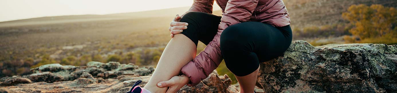 Woman outside with a leg injury