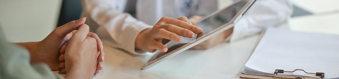 Doctor showing patient a chart on an iPad