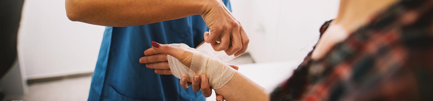 nurse bandaging a patient