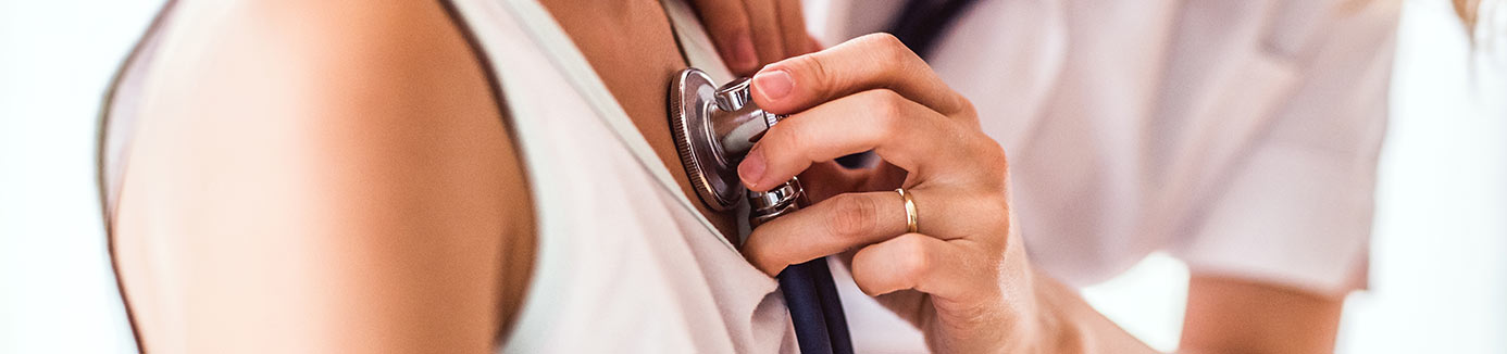 Doctor checking heart rate with stethoscope