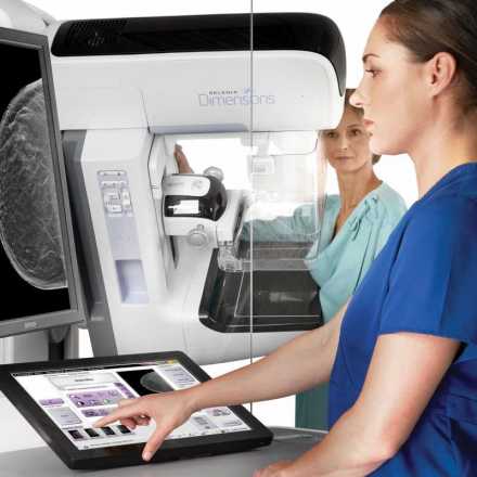 Patient receiving Genius™ 3D Mammography™ exam