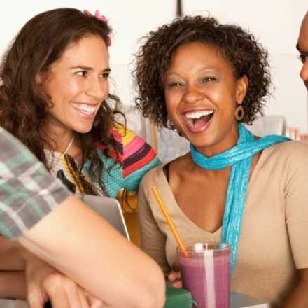 Two women and two men laughing together