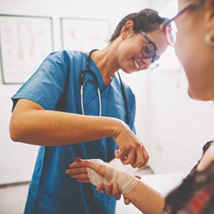 care provider wrapping a wrist