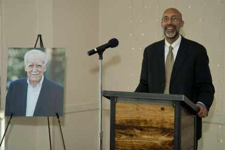 Dr. Gurpreet Dhaliwal speaking behind podium