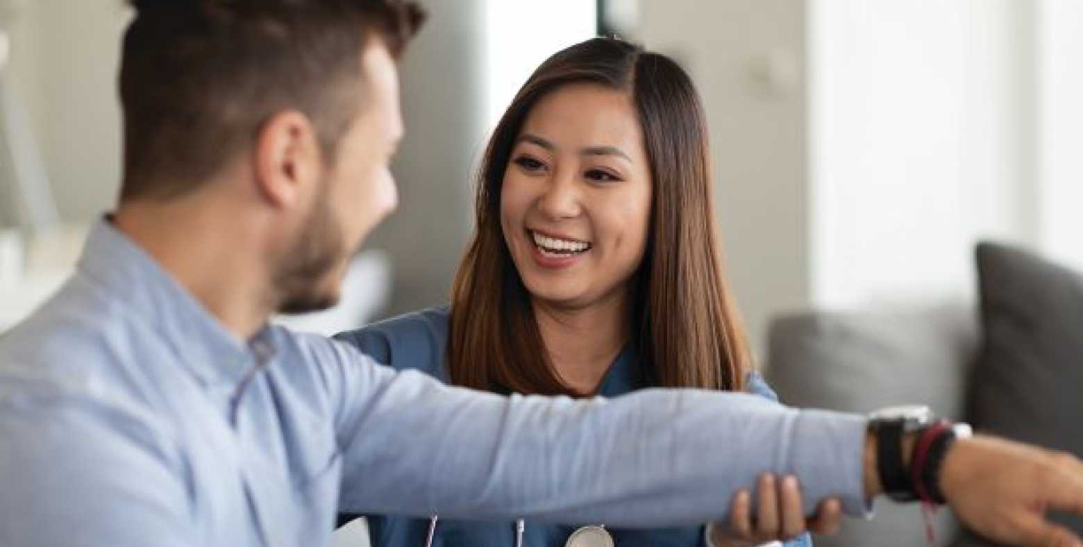 female occupational health therapist working with male patient