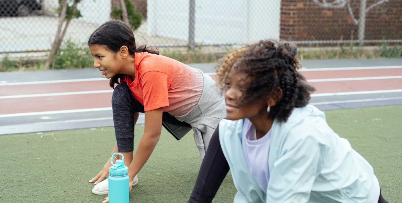 Girls stretching at track practice