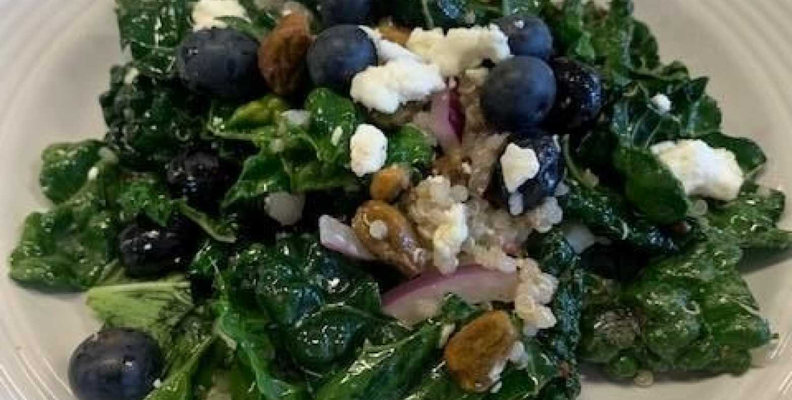 quinoa kale salad with blueberries, feta and lemon vinaigrette