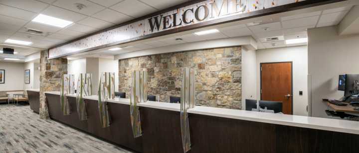 Front desk with welcome sign for multi specialty clinics on 2nd floor of Tahoe Forest Cancer Center